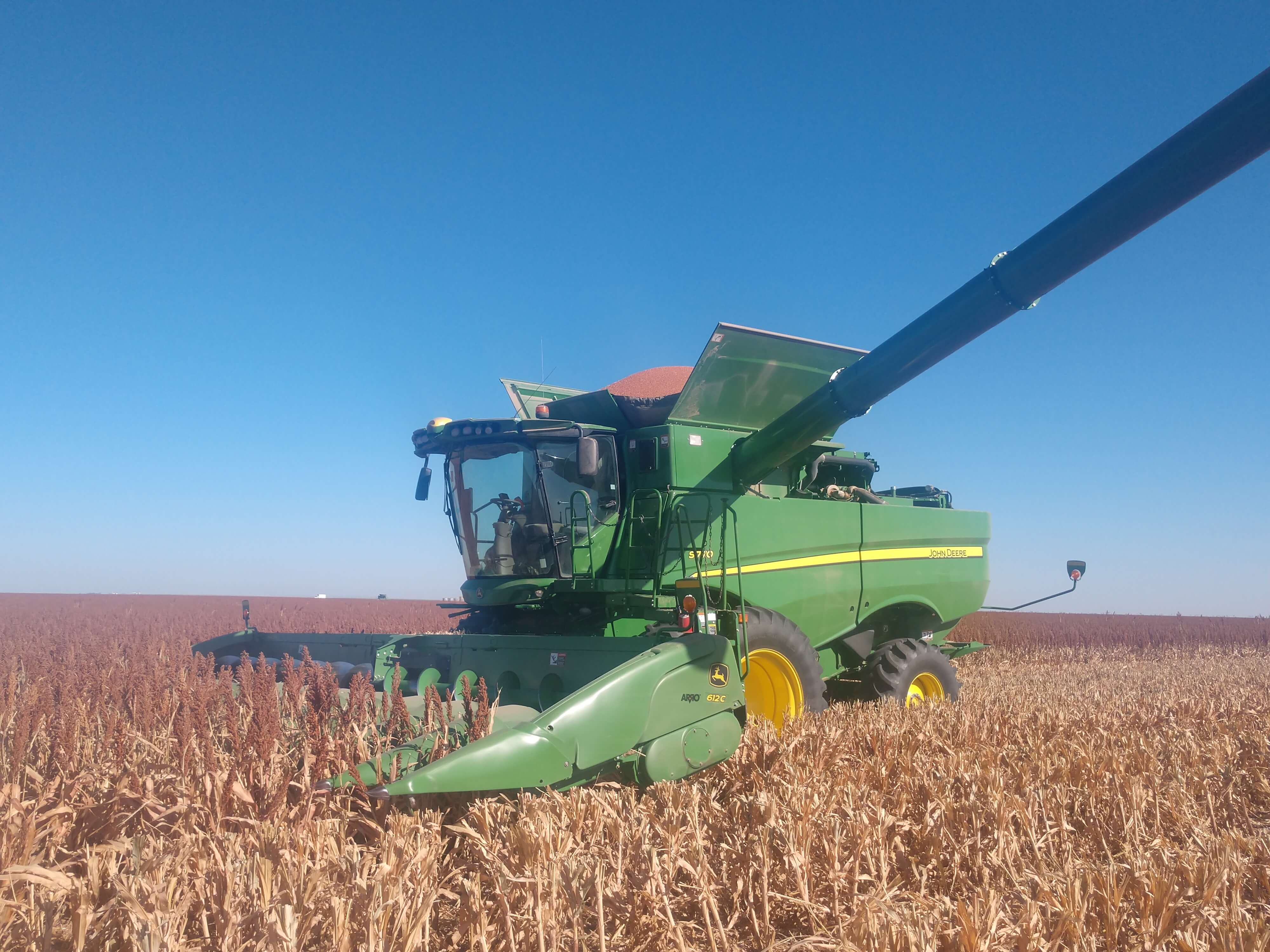 Green John Deere combine using ARRO®.